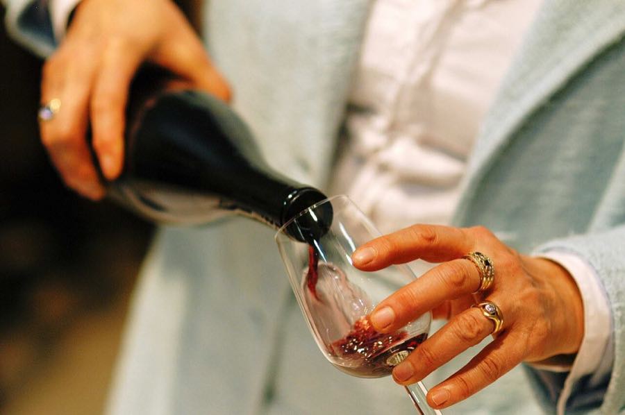 Red wine being poured into a glass